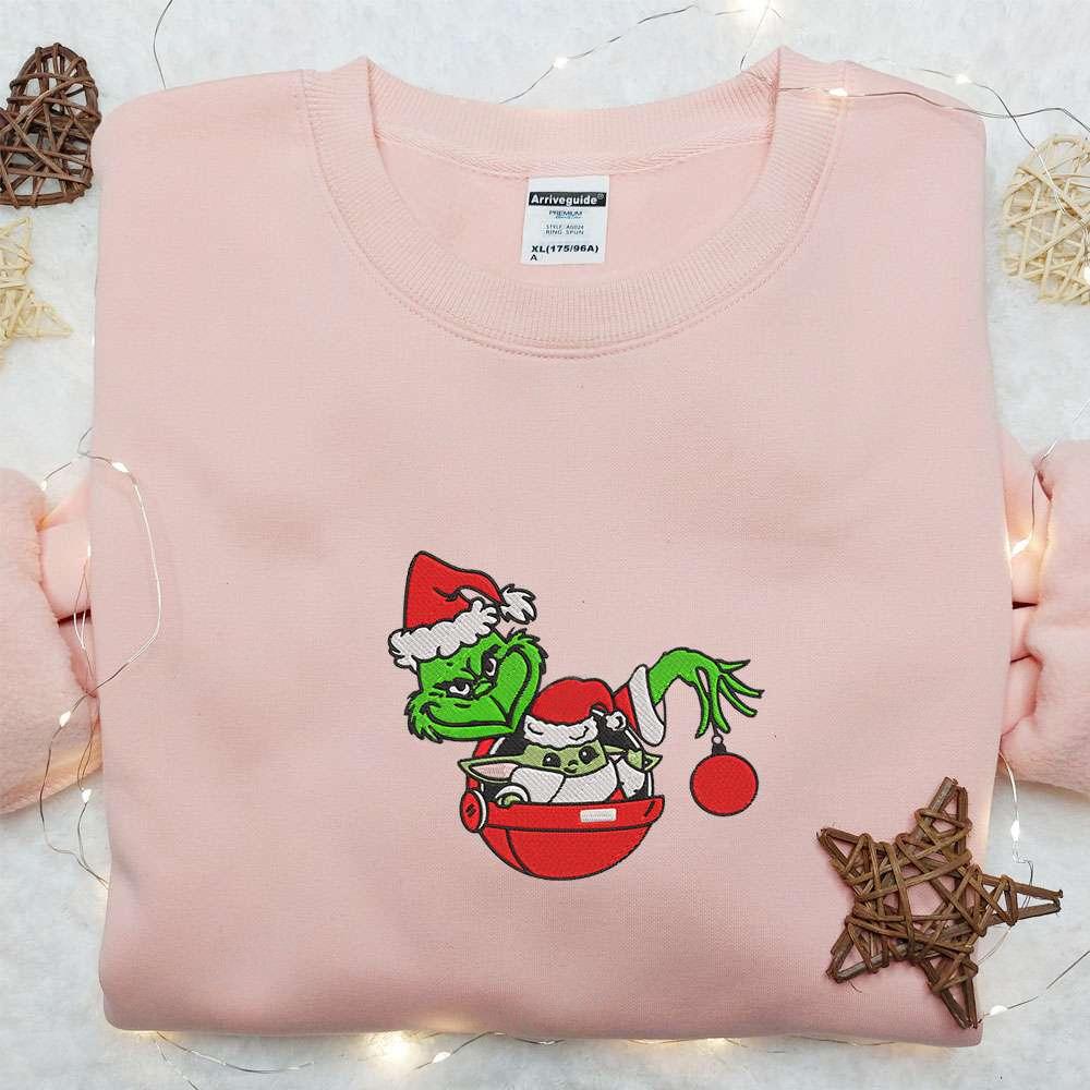 Grinch Holding Baby Yoda Christmas Embroidered Sweatshirt Movie Christmas Embroidered Hoodie Best Christmas Gift Ideas For Family
