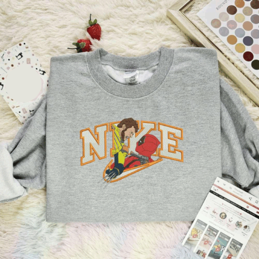 Wolverine And Deadpool Fighting X Nike Embroidered Shirt Marvel Movie Characters Embroidered Hoodie, Best Gift For Fans